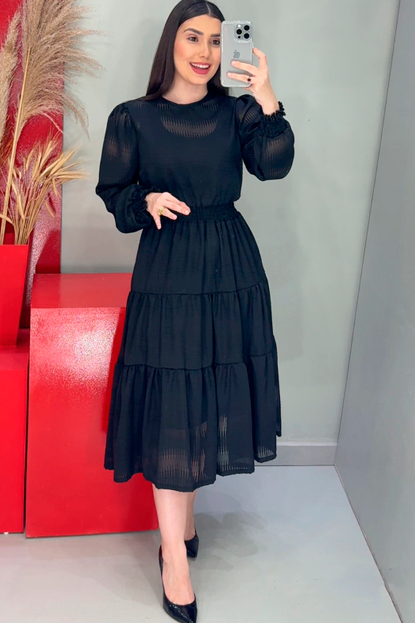 Black dress with intricate fabric Guipir details on the collar